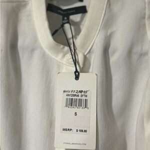 Beautiful blouse with cut out shoulders with tie backs